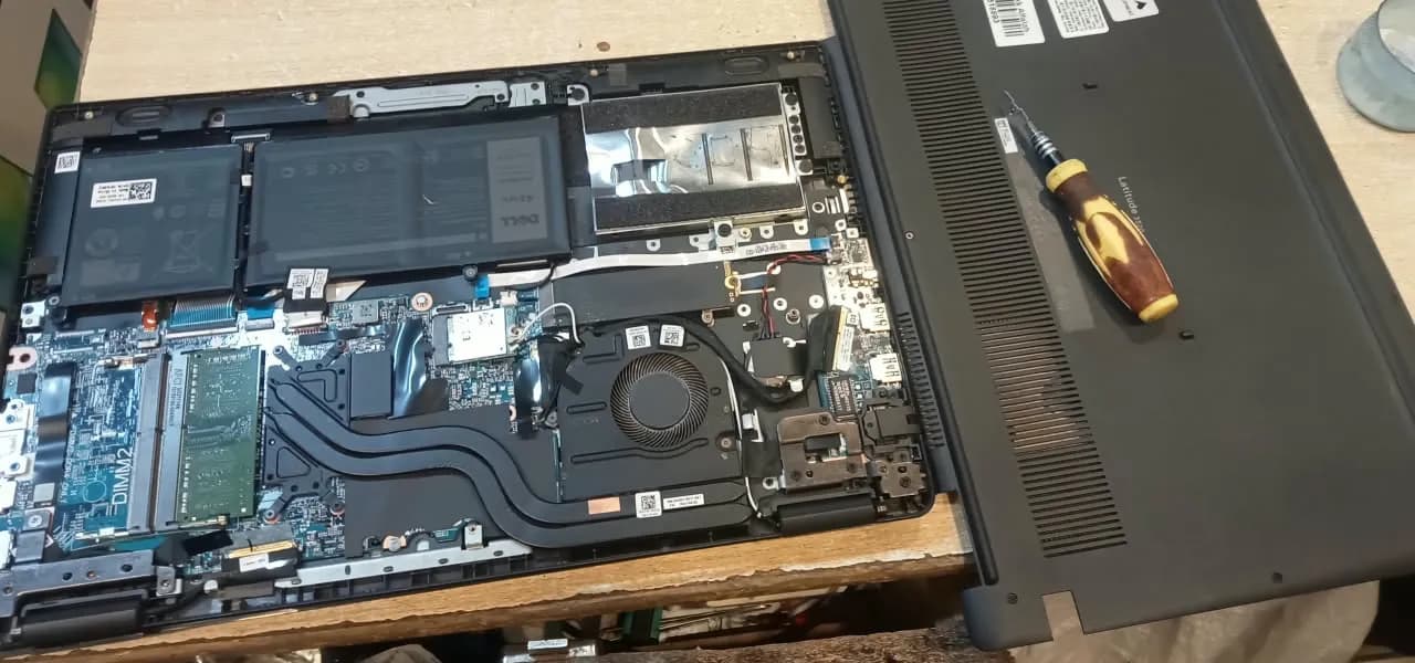 Technician diagnosing dead laptop motherboard power circuit and chip level repair at IT Repair Hub Lahore